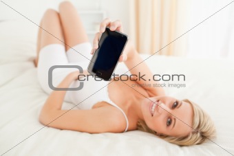 Woman showing her smartphone