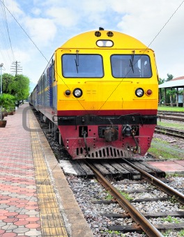Thai colorful train arriving at station