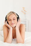 Portrait of a delighted woman wearing headphones