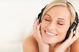 Close up of a serene woman wearing headphones
