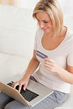 Close up of a charming woman buying online