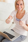 Close up of a cheerful woman buying online