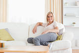 Relaxed woman sitting on a sofa