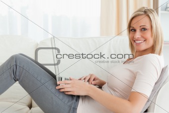 Blond-haired woman surfing on the internet