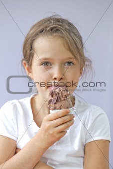 Girl eating chocolate ice cream