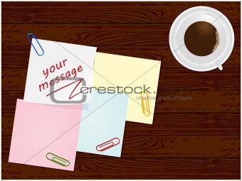 Wooden board with leaves and paper clips and cup of coffee