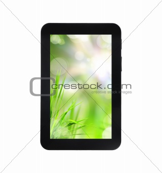 fresh grass on tablet PC isolated on white background