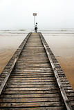 Teenage girl on old sea pier