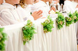 children accepting the first Holy Communion 