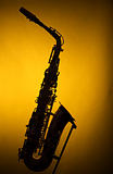 Saxophone Silhouette Against Yellow