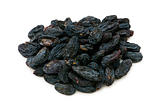 Black raisins isolated on the white background