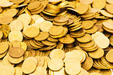 Pile of golden  coins isolated on white