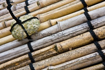 Stone on bamboo