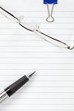 Pen and Glasses on a Notepad