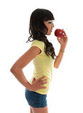 Healthy girl eating fruit