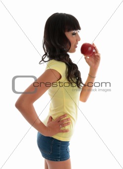 Healthy girl eating fruit