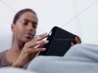 woman using tablet pc at home