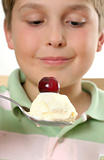 Boy with ice cream and cherry on top