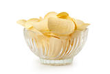 Delicious potato chips in white bowl