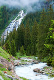 Alps waterfall summer view