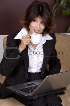 young business woman holding coffee cup