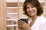 brunette holding cup of coffee