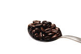 coffee beans on spoon