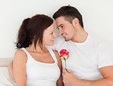 Delightful couple with a rose