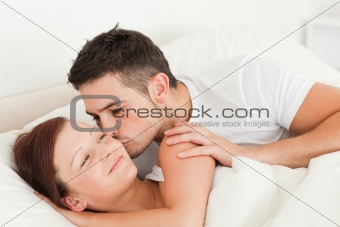 Man kissing his wife on the cheek