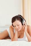 Close up of a Woman listening to music with closed eyes