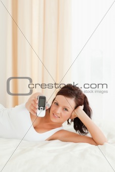 Cute woman showing mobile