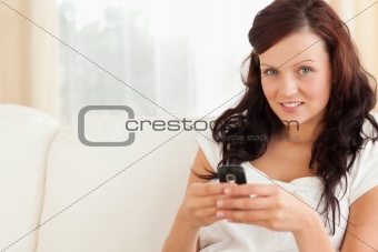 Young woman texting on mobile
