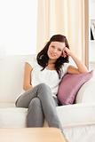 Portrait of a cute posing woman on a sofa