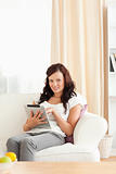 Charming woman holding a tablet