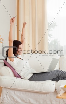 Cheerful woman with a laptop
