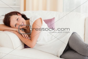 Cute woman relaxing on her sofa