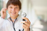 Smiling doctor holding a stethoscope