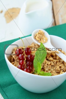 bowl of cornflakes with milk and  berries, healthy breakfast