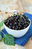 black currants ripe and natural on a wooden table
