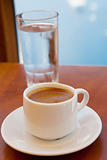 Greek coffee and a glass of water