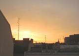 sunrise and city roofs