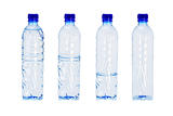 Plastic bottles with different water levels inside