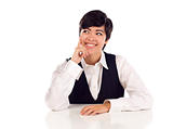 Attractive Smiling Mixed Race Young Adult Female At White Table Looking Up and Away Isolated on a White Background.
