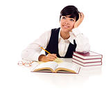 Daydreaming Mixed Race Young Adult Female At White Table with Books Looking Up and Away Isolated on a White Background.
