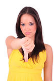 young unhappy and disappointed female shows thumbs down gesture,