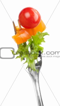 red tomato and salad on a fork