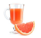 Full glass of grapefruit juice and fruit