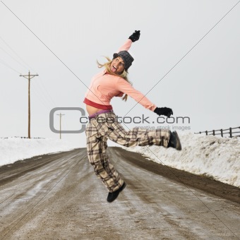 Woman jumping joyfully.