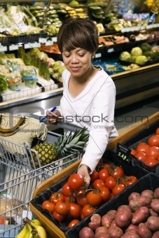 Woman grocery shopping.