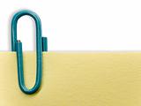 Blue paperclip on a white background with shadow